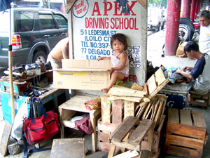 Kid in sidewalk