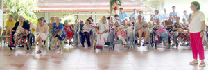 The Asilo de Molo residents listen to a housemate sing