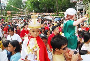 Catholic faithful come out of the Sta. Ana parish church in Molo