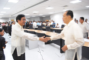 Vice Governor Rolex Suplico reaches a hand to his uncle Gov. Niel Tupas Sr.