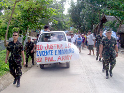 Soldiers and reservists carry and accompany the remains of former Army Sgt. Vicente Maming before the funeral procession.