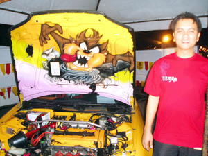 JR Tugbang with his car and the Tazmanian Devil