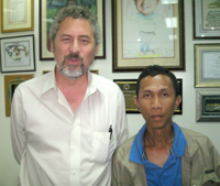 Counselor  for Economic Affairs Larry L. Memmott (left) of the Embassy of the United  States of America with Jonavin V. Villalba of Aksyon Radyo Iloilo.