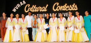 Proud and beaming. Elementary folk dancers from Antique posed with their trainer and other officials from Antique after they bested other dancers in what was dubbed as the "battle of Sayaw sa Cuyo".