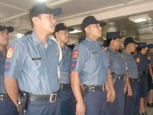 Policemen attend yesterday's launching of “Mamang Pulis / Aleng Pulis