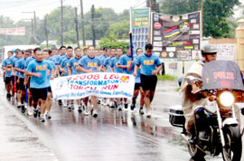 Antique PPO Extra Mile Runners. Insp. Rio P. Maymay (middle, front row) leads 40 PNP personnel during the 10-kilometer run from Hamtic town to Antique PPO headquarters as part of the PNP Transformation Torch Run in the province
