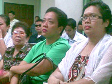 From left: Hinolan's mother Sonia, widow Aphrodite and Emely Ureta, widow of Aklan broadcaster Rolando Ureta.