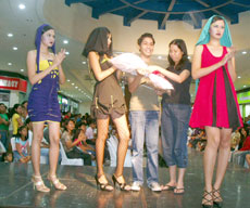 Robbie Pacificar (3rd from left) with Adelle Pacificar and models