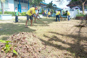 Parents, teachers, and schoolchildren at Mandurriao Elementary School join together in cleaning up the school premises