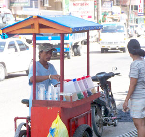 A man sells “halo-halo” on a cart.