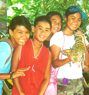 Athletes with a crocodile in Palawan
