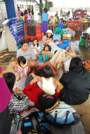 Evacuees at the covered parking area of SM City Iloilo.