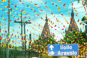 Banderitas (colorful trimmings) now adorn the skyline of Molo district