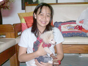 With her dog Ferdie.