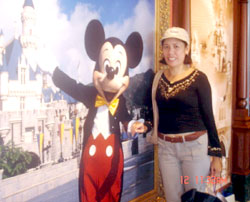 With Mickey Mouse, her favorite childhood character.