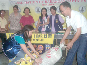 The Gardenia Lions Club led by Dr. Liza Mabunay Jover donate relief goods to Typhoon Frank victims in Jaro represented by Barangay Captain Joonas Bellosillo, president of the Association of Barangay Captains, Jaro District. 