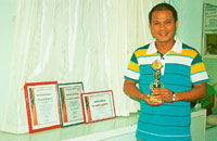 Prof Erwin Sustento with his awards.