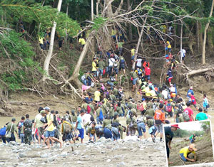 Joshua Edubalad, a gradeschool pupil, is not only planting a tree at the Maasin Watershed