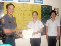City Social Welfare Development Officer III Ruby Lopez presents a Certificate of Appreciation to PO2 Francisco B Lindero Jr, guest speaker during the Family Day celebration of CSWDO - Jaro District II, Iloilo City.