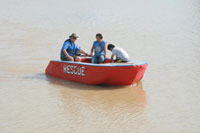 Mariano Griño (with hat) test drives his invention at the Jalaur River in Iloilo. 