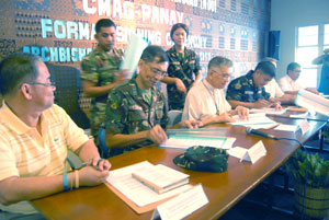 Church and military officials sign the memorandum of understanding creating of the Church-Military Advisory Group (CMAG)
