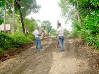 Reshaping, crowning and ditching works by an organic road grader.