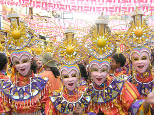 Participants to the Masskara Festival in Bacolod City show off their colorful smiling masks