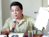 Councilor Alex Paglumotan, Chairman of the Committee on Markets and Slaughterhouse holds a copy of the list of old slaughterhouse residents who can avail financial assistance from City Government through Mayor Evelio Leonardia. 