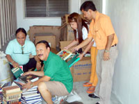 Iloilo Emerald Lions Club, Inc. Pres. Rodrigo Sorongon, PP Lion Remy Gumban, Lion Romeo Cahilgan, PP Lion Joeboy Agriam and Lion Teresa Macalalag are sorting books for donation to elementary and secondary schools in Iloilo. The 9 big boxes of books were from Jun Colmenares and the Filipino Association of Hawaii thru the efforts of PP Lion Joeboy Agriam. 