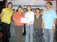 Bacolod City Councilor Celia Flor (center) accepts the Most Child Friendly City award from RSCWC Chairperson Teresita Rosales (2nd from left). Also in photo are (from left) DSSD Head Sally Abelarde, Local Council for the Protection of the Child member Ma. Elena Gumabong and City Councilor Homer Bais.