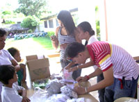 Juan Miguel with grandmother Sonia Flores and his brother.