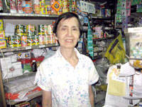 Tya Mel standing behind the counter.