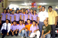 Catalino Albar III, store and operations manager (in yellow shirt) with SOS staff.