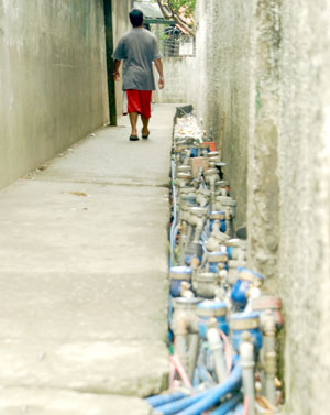 An array of water meters along a footwalk in Brgy. West Habog-habog Molo. Certain service areas of Metro Iloilo Water District currently suffer intermittent or absence of water supply.