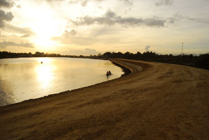 A view of sunset at the Iloilo River with the still-unfinished boulevard connecting Diversion Road and Tabucan, Mandurriao on the right.