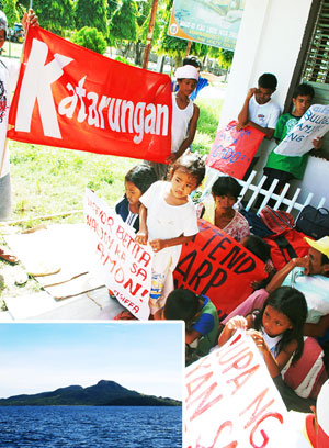 Displaced residents from Sicogon Island hold a protest action at the town plaza of Carles, Iloilo. (Inset) A view of the Sicogon Island.