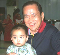 NFSP President Enrique 'Nene' Rojas beams proudly with his grandson Anton.