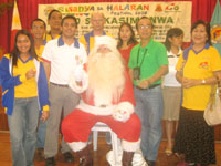 Santa with the adults! Attending Rotarians and their spouses with Rotakids Danica So Chan