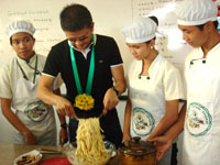 The senator helps prepare the pasta.