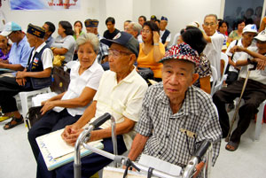 89 year-old Jeremias Fufugal Faeldonea (wearing a US flag-designed cap) along with other World War II veterans.