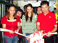 Ribbon Cutting Ceremony Headed by Vice Mayor Jed Mabilog assisted by owner April Besara (extreme left) and Sandra Larson (middle).