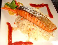Pan-fried Norwegian Salmon on Rice Pilaf with Spicy Tomato Sauce.