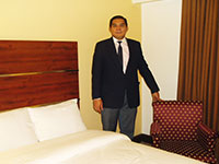 Inky in one of Days Hotel's modern rooms.