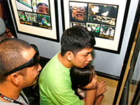 Angelo Jardeleza looks at his works on exhibit after his photography workshop.
