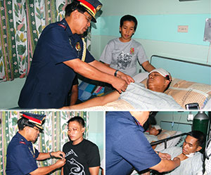 Police Regional Office 6 regional director Chief Supt. Isagani Cuevas pins wounded PNP medals.