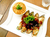 Baked New Zealand Mussels with Mojave Barbecue Sauce and Mexican Rice.