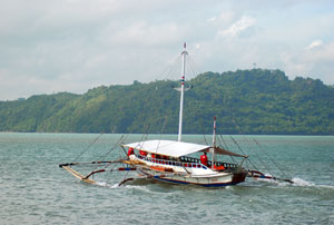 A passenger pumpboat leaves the Ortiz wharf in Iloilo City for Jordan, Guimaras.