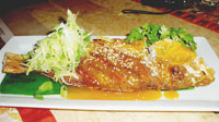 Crispy Fried Red Snapper with Ginger and Leeks, Hot Orange and Sesame Glaze.