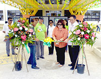 Ana Maria Nava, DTI's Dominic Abad and DA's Larry Nacionales signal the opening of the exhibit.