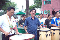 Chairman Bayani tries out the drumbeating with Mayor Honrado.
